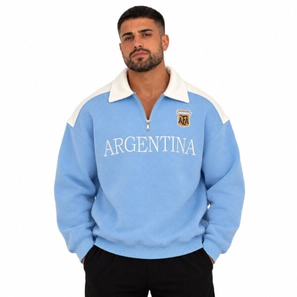 Argentina quarter zip polo sweatshirt sky blue front view with cream collar AFA crest and ARGENTINA wordmark - UAE SPORT STORE Argentina quarter zip polo sweatshirt sky blue front view with cream collar AFA crest and ARGENTINA wordmark
