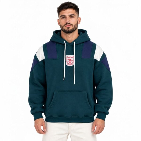 Arsenal retro panel hoodie dark green front view with navy and cream shoulder panels and vintage crest - UAE SPORT STORE Arsenal retro panel hoodie dark green front view with navy and cream shoulder panels and vintage crest