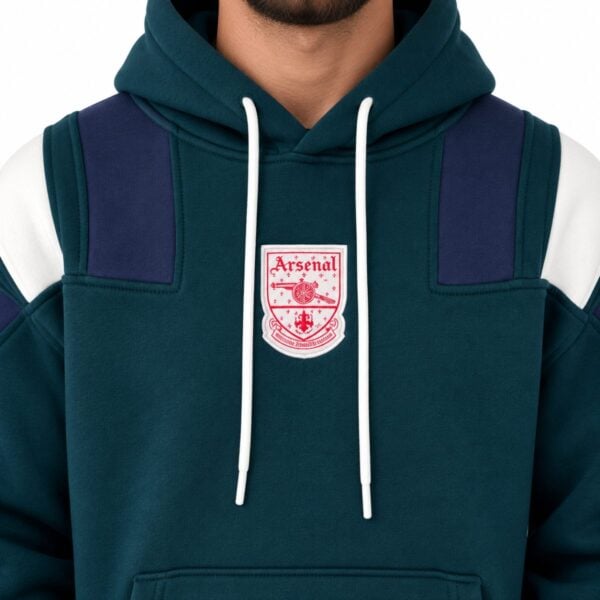 Arsenal hoodie close-up of woven vintage Arsenal crest patch navy shoulder blocks and white drawcords