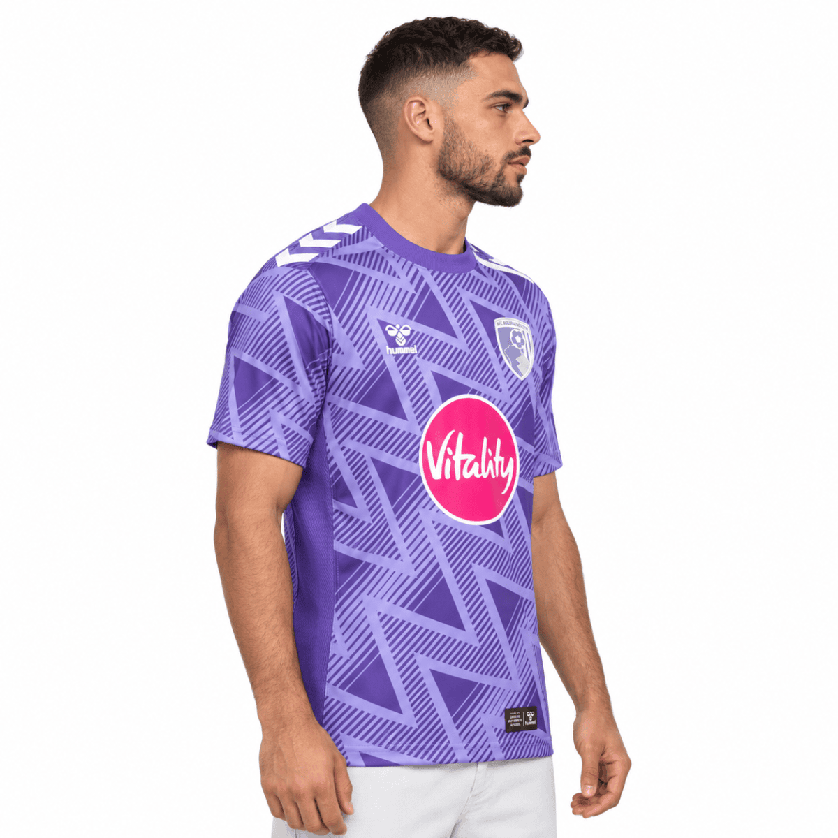 A man wearing AFC Bournemouth away jersey 2026/27 in purple with pink sponsor logo.