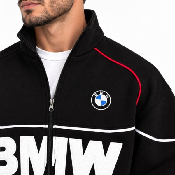 BMW track jacket close-up of embroidered roundel stand collar metal zip and red shoulder piping