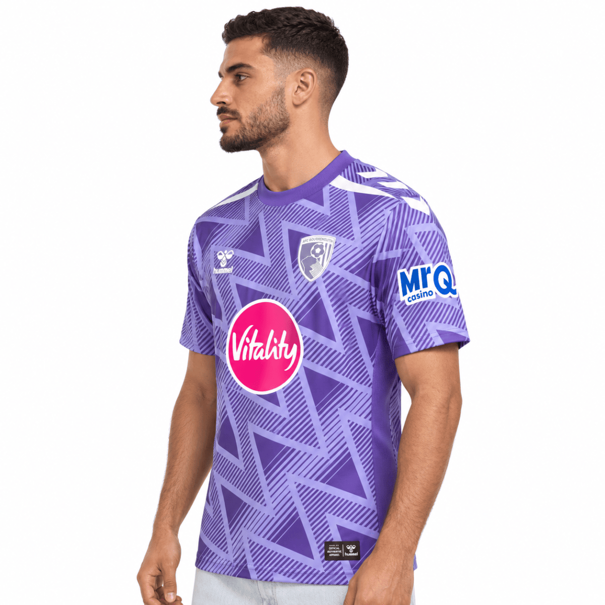 A man wearing AFC Bournemouth away jersey 2026/27 in purple with geometric pattern.