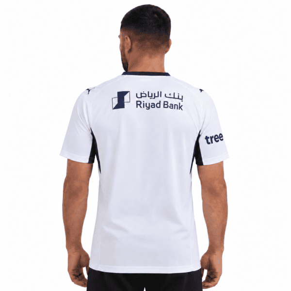 Al Hilal away jersey 2026/27 with Riyad Bank logo on back, white with blue accents.