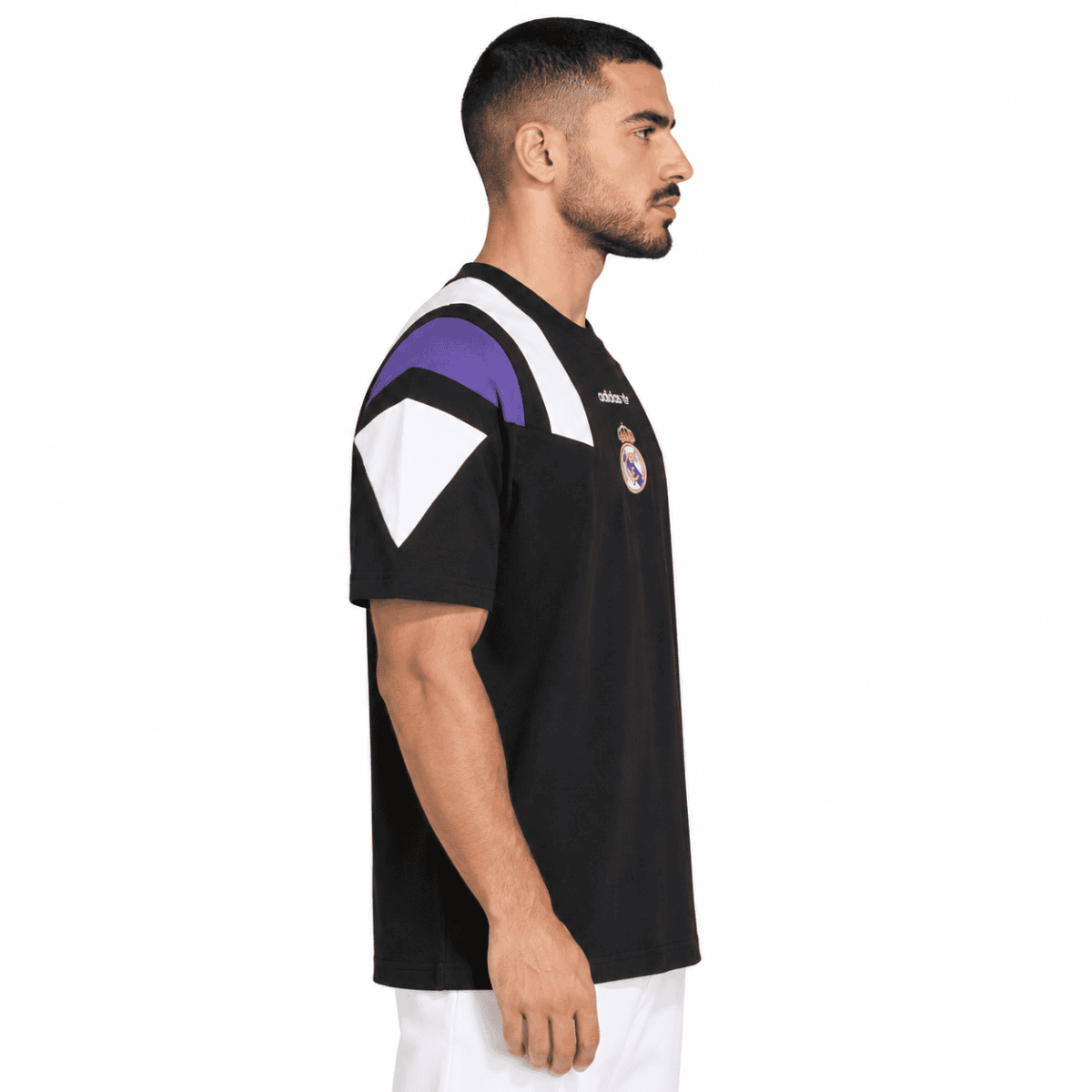 Real Madrid football jersey with black, purple, and white colors, club crest visible.