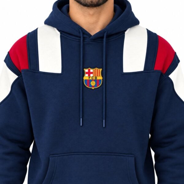 FC Barcelona hoodie close-up of embroidered FCB crest with cream and red shoulder panelling