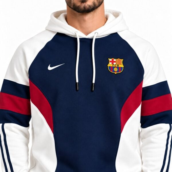 FC Barcelona hoodie close-up of embroidered FCB crest curved seams and crimson chest panel
