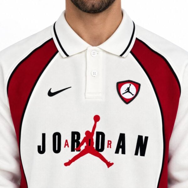 Jordan polo sweatshirt close-up of black tipped collar black piping Jumpman shield and chest graphic