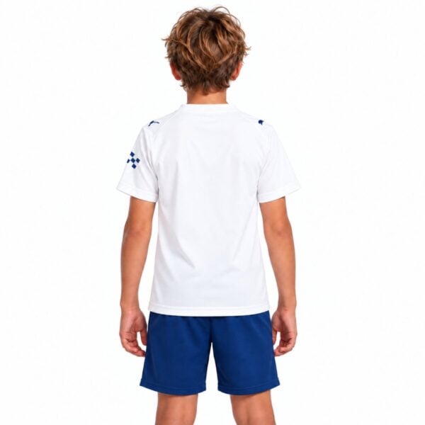 Manchester City third kids kit back view plain white jersey with sleeve patch and navy shorts