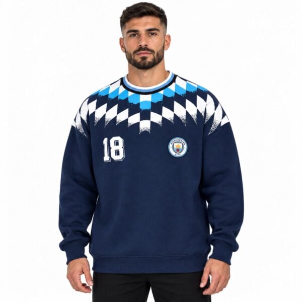 Manchester City argyle crewneck sweatshirt navy front view with embroidered crest number 18 and diamond yoke - UAE SPORT STORE Manchester City argyle crewneck sweatshirt navy front view with embroidered crest number 18 and diamond yoke