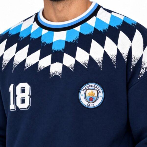 Manchester City sweatshirt close-up of embroidered crest varsity 18 striped ringer collar and argyle dot fade