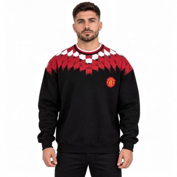 Manchester United argyle crewneck sweatshirt black and red front view with embroidered crest and diamond yoke - UAE SPORT STORE Manchester United argyle crewneck sweatshirt black and red front view with embroidered crest and diamond yoke