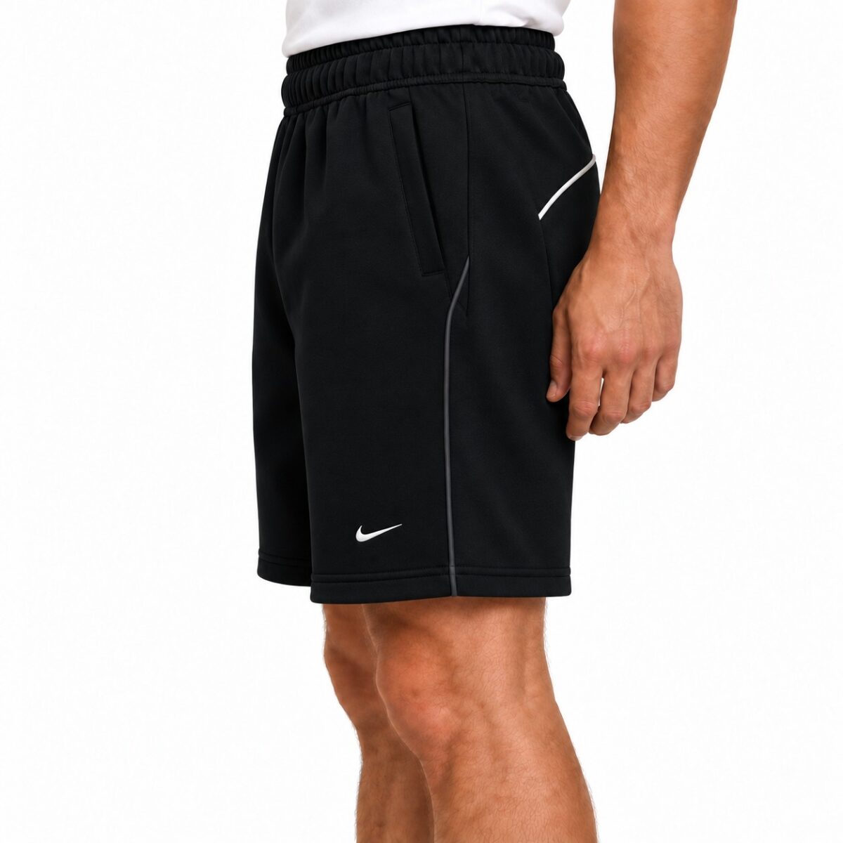 Black Nike sports shorts with white logo and piping, men's athletic wear.