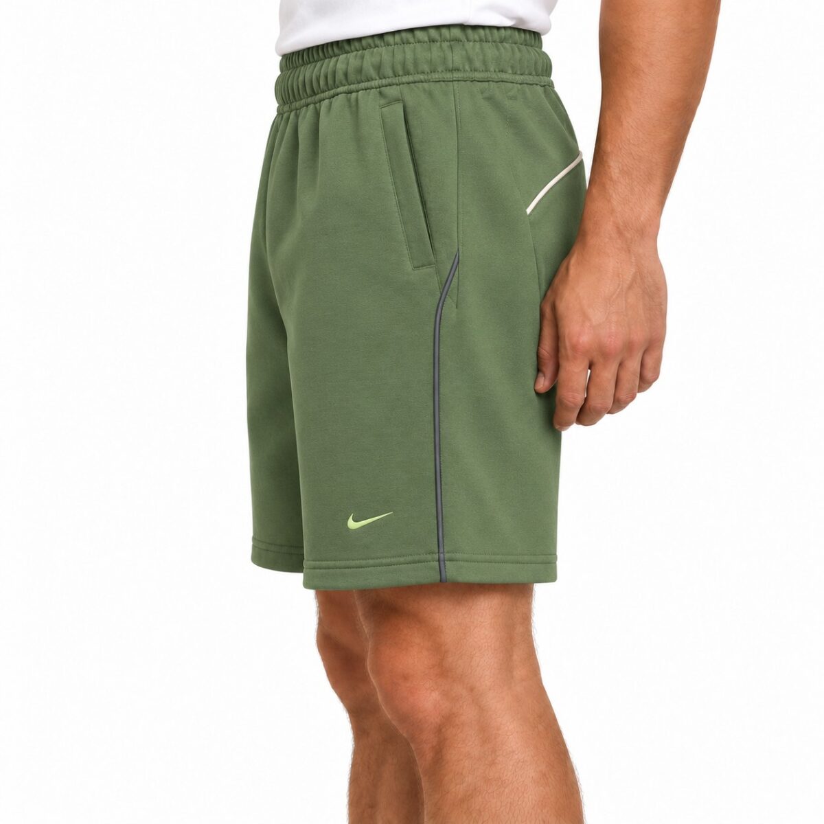 Green Nike sports shorts with side pocket and logo, men's athletic wear.