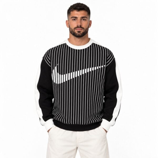 Nike pinstripe oversized sweatshirt black and white front view with large swoosh formed by the stripes - UAE SPORT STORE Nike pinstripe oversized sweatshirt black and white front view with large swoosh formed by the stripes