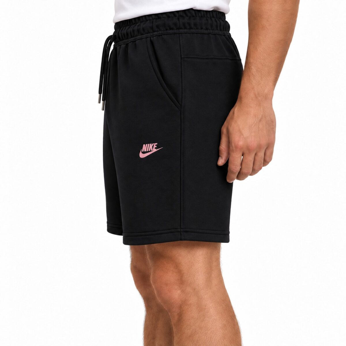 Black Nike shorts with pink logo, elastic waistband, and side pockets.