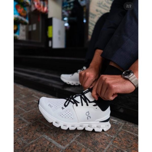 On Cloud X 4 Ivory Black side profile showing the CloudTec sole and black laces - UAE SPORT STORE On Cloud X 4 Ivory Black side profile showing the CloudTec sole and black laces