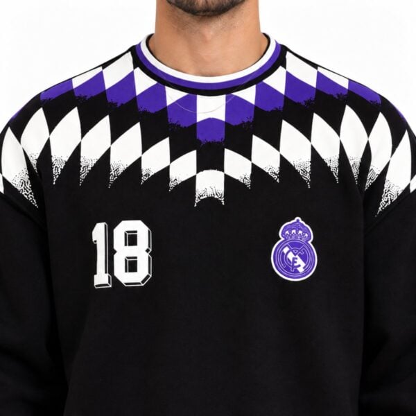 Real Madrid argyle sweatshirt chest close-up showing purple argyle dot fade crest and white varsity 18