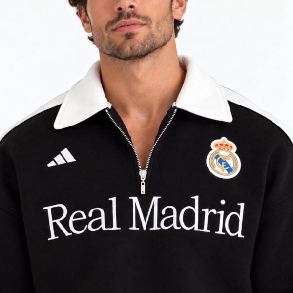Real Madrid quarter zip polo close up of cream collar crest and wordmark