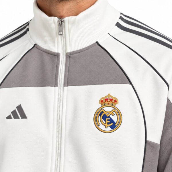 Real Madrid track jacket close up of embroidered crest and stand collar