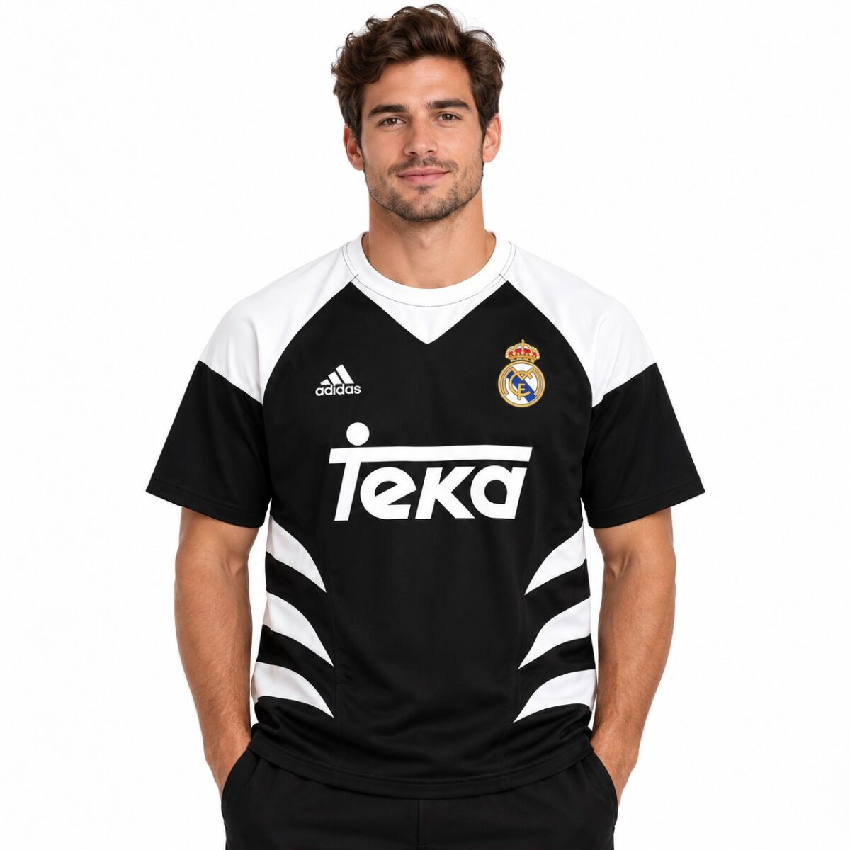 Real Madrid away football jersey with black and white design and sponsor logo.