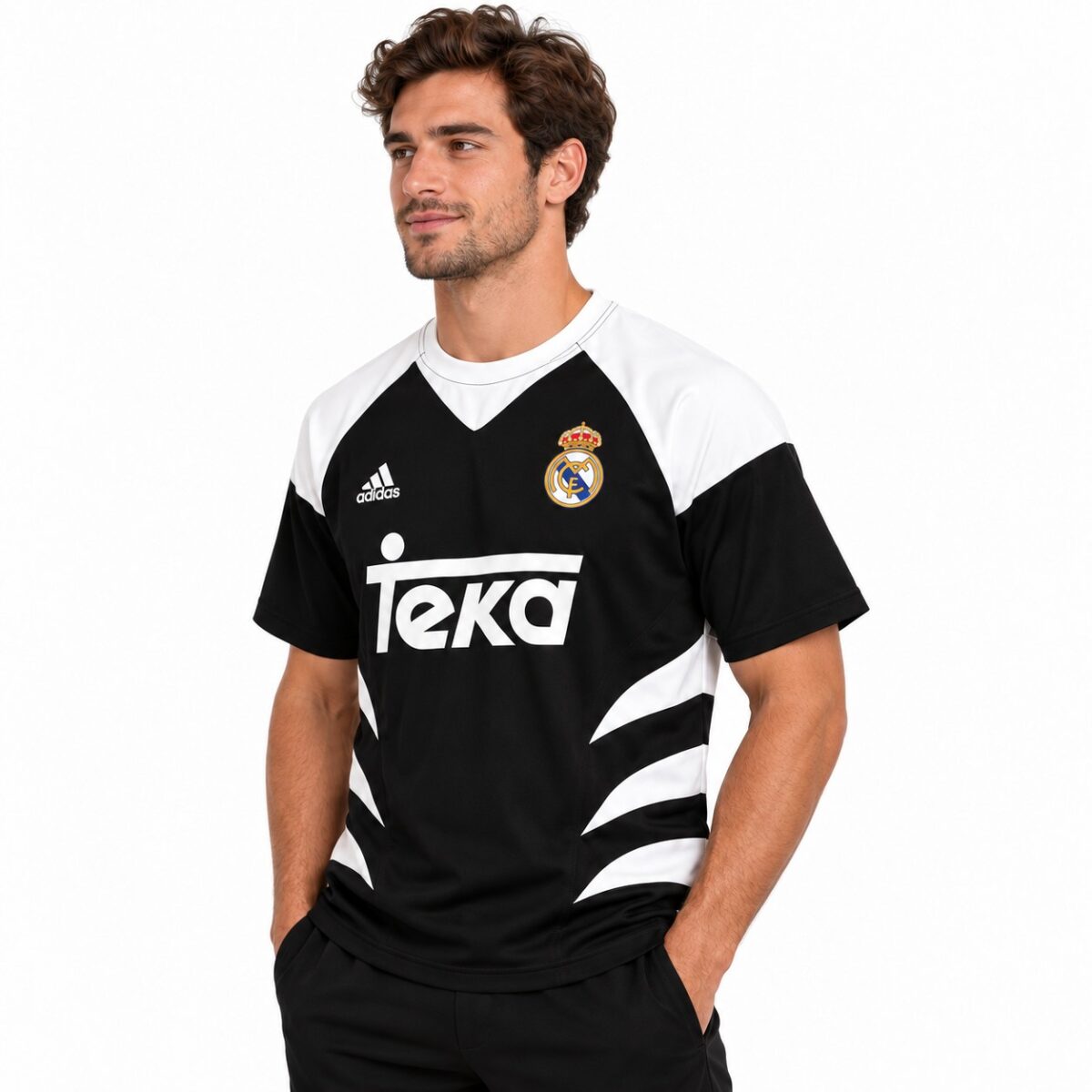 Real Madrid away football jersey with black and white design, season not specified.
