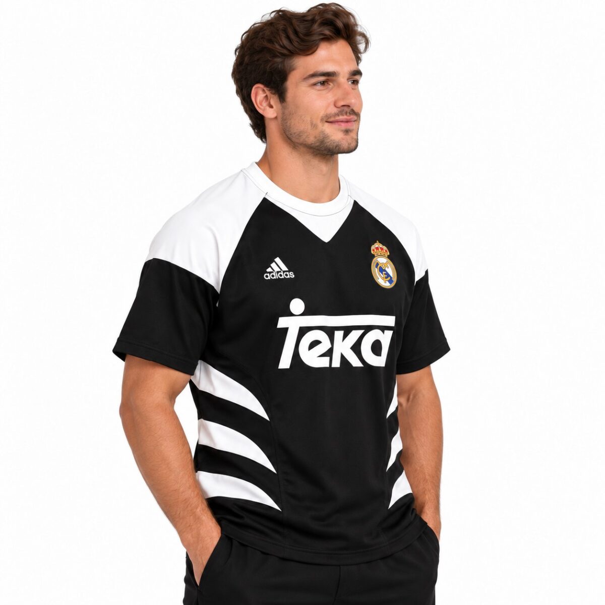 Real Madrid away football jersey with black and white design and club crest.