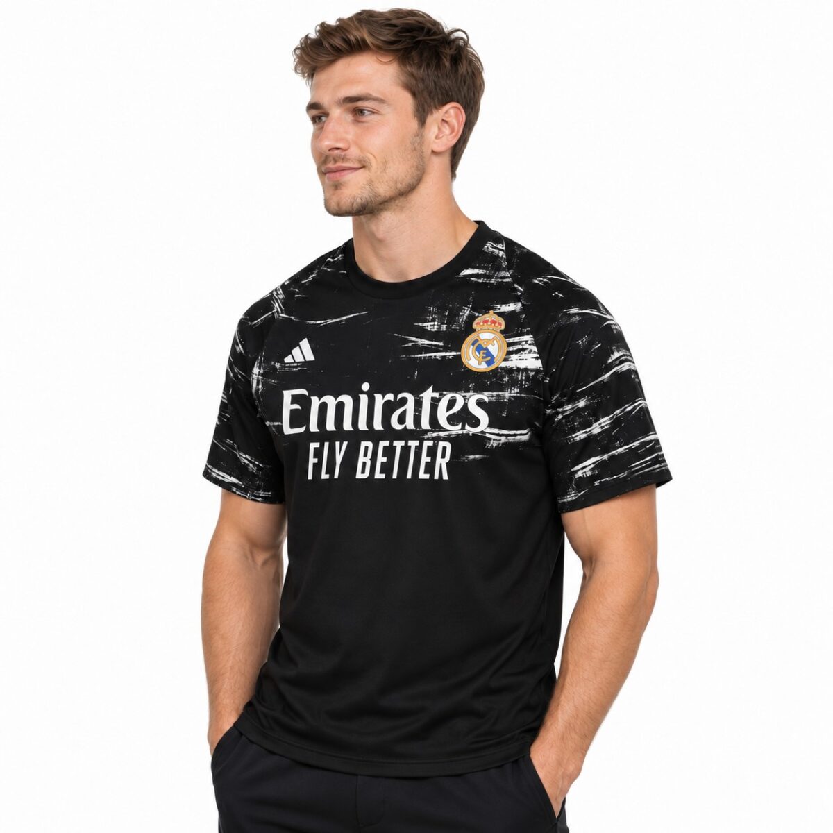 Real Madrid black away football jersey with club crest and Emirates sponsor logo.