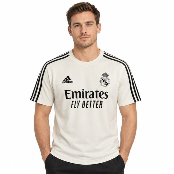Real Madrid away kit jersey with Adidas logo and Emirates sponsor, white with black accents.